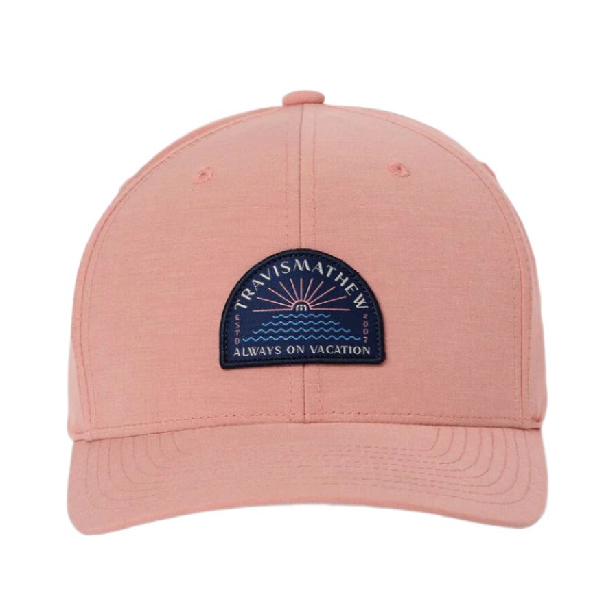 Pink cap with a blue patch on a white background