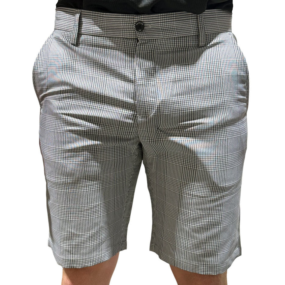 Checkered shorts worn by a person on a white background