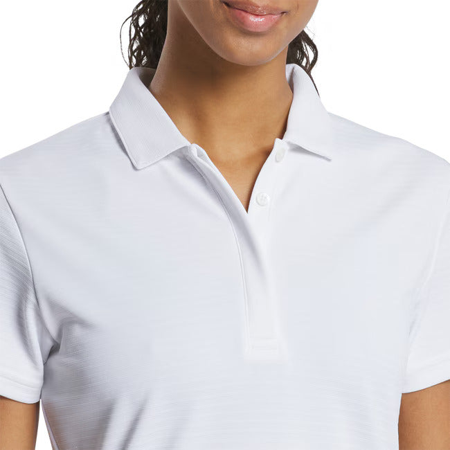 White polo shirt worn by a person on a white background