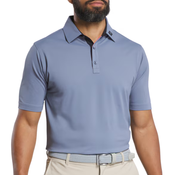 Man wearing a light blue polo shirt on a white background
