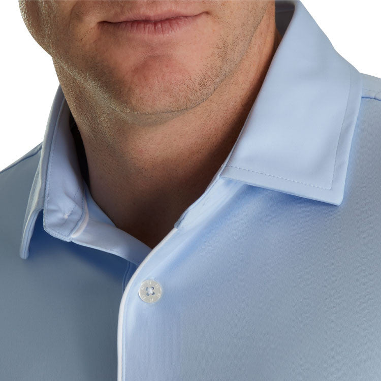man wearing light blue golf polo long sleeve