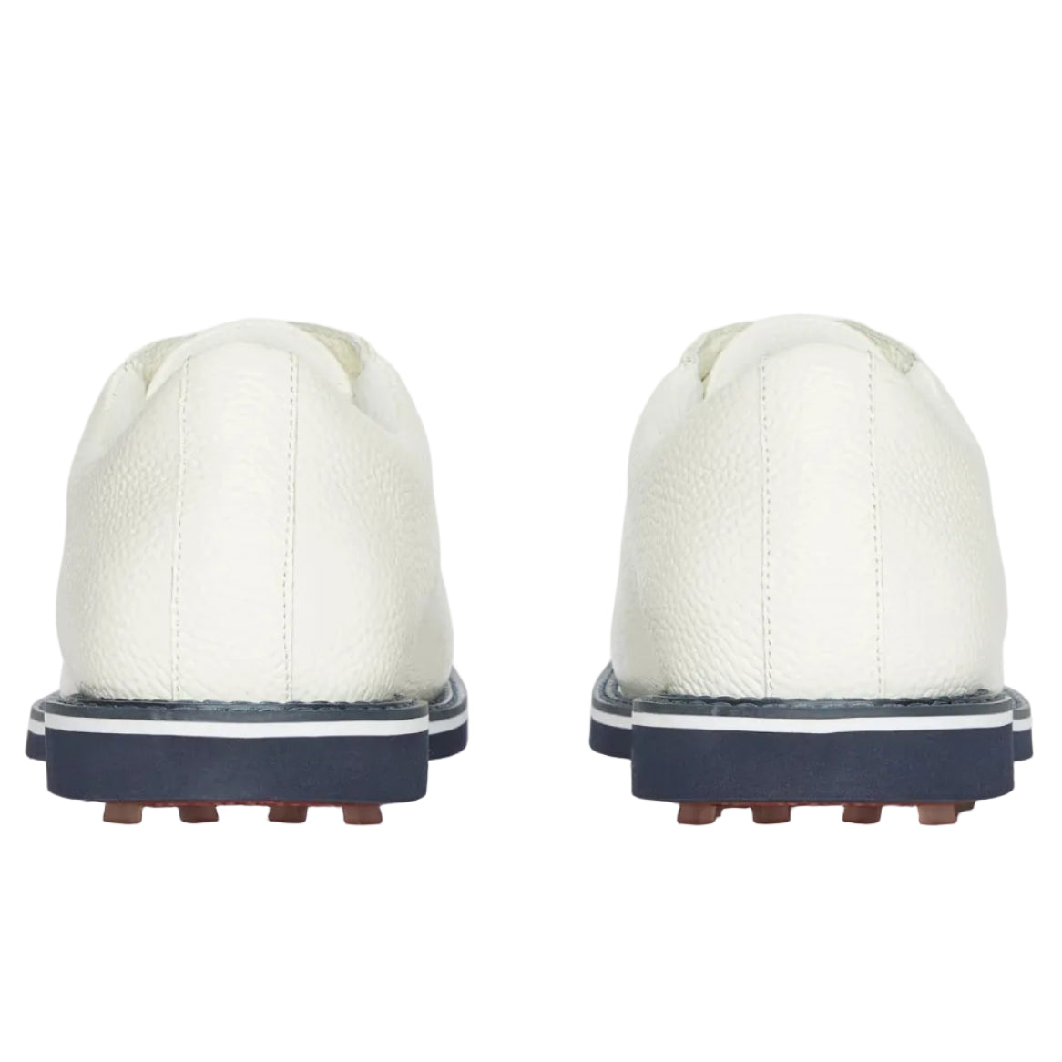 White golf shoes with navy soles on a white background