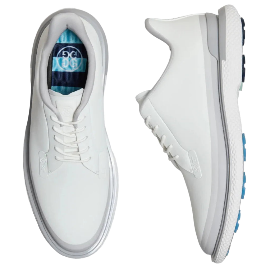 White golf shoes with blue accents on a light gray background