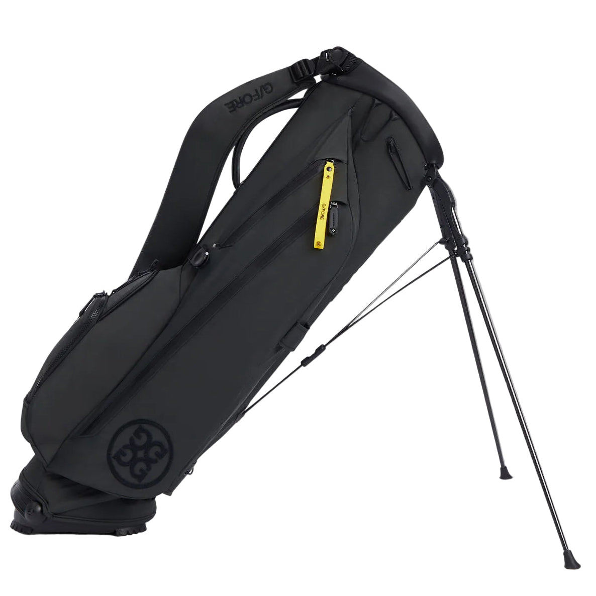 Black golf stand bag with a yellow tag on a white background