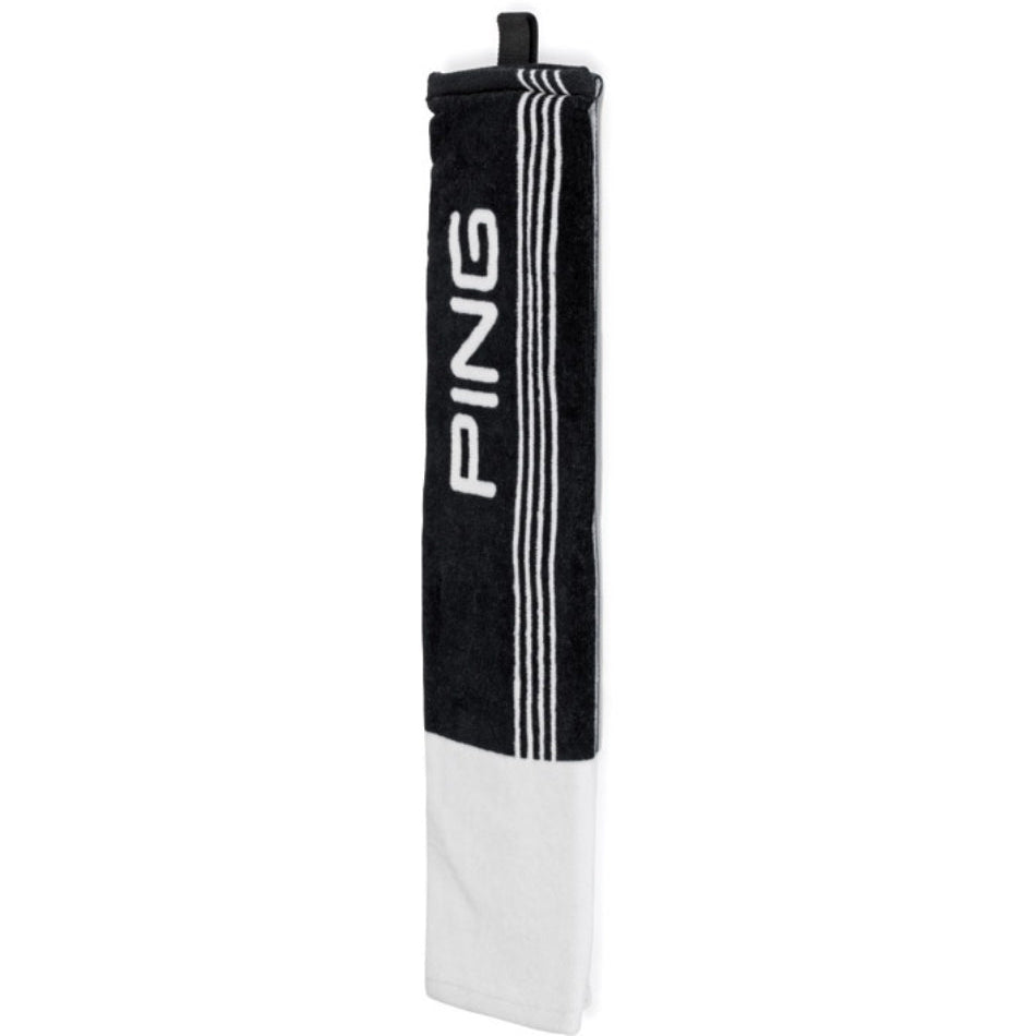 A black and white tri-fold golf towel with the brand name 'PING' written in large letters on the front.