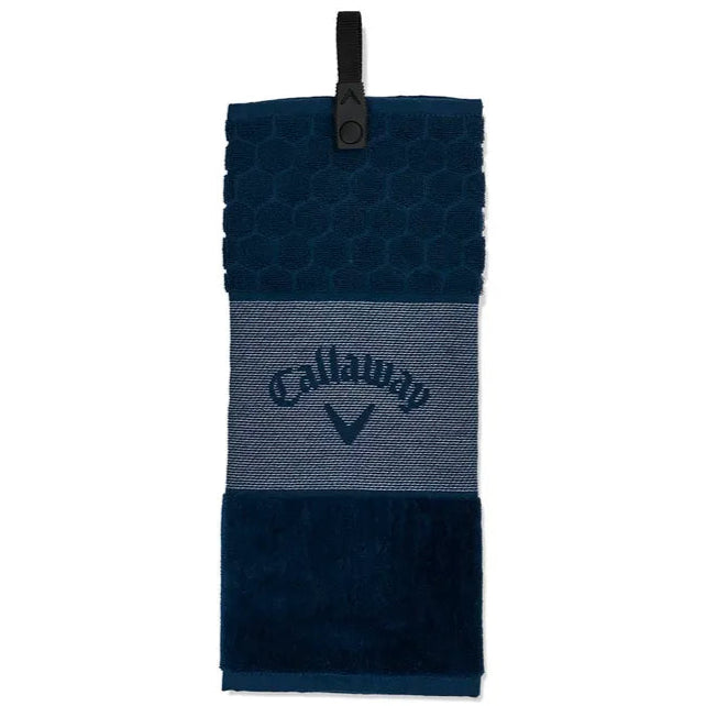A navy Callaway tri-fold golf towel with a logo in the center and a snap attachment.