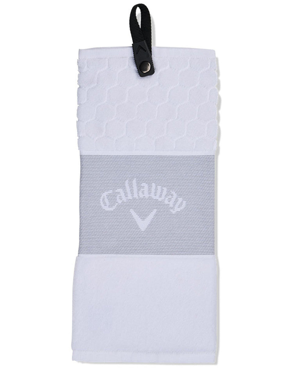 A black and gray Callaway tri-fold golf towel with a logo in the center and a snap attachment.