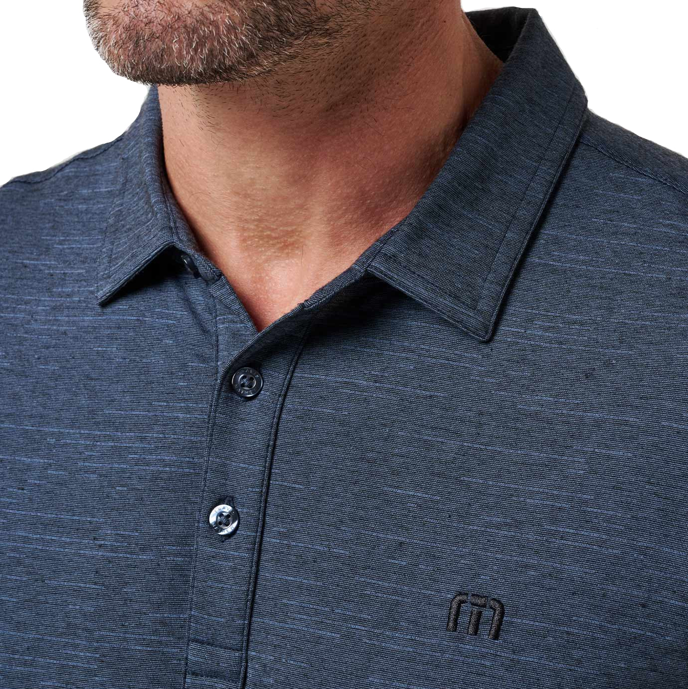 Close-up of a dark blue polo shirt with a brand logo 