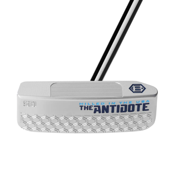 A Bettinardi Antidote SB1 putter with a silver body, blue accent on the grip, and a white and blue diamond pattern just behind the grip.