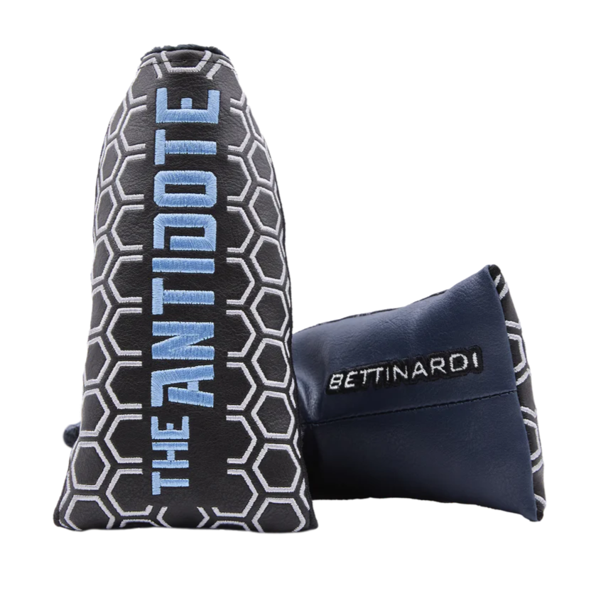 Golf club head cover with 'The Antidote' branding and another cover with 'Bettinardi' branding on a white background.