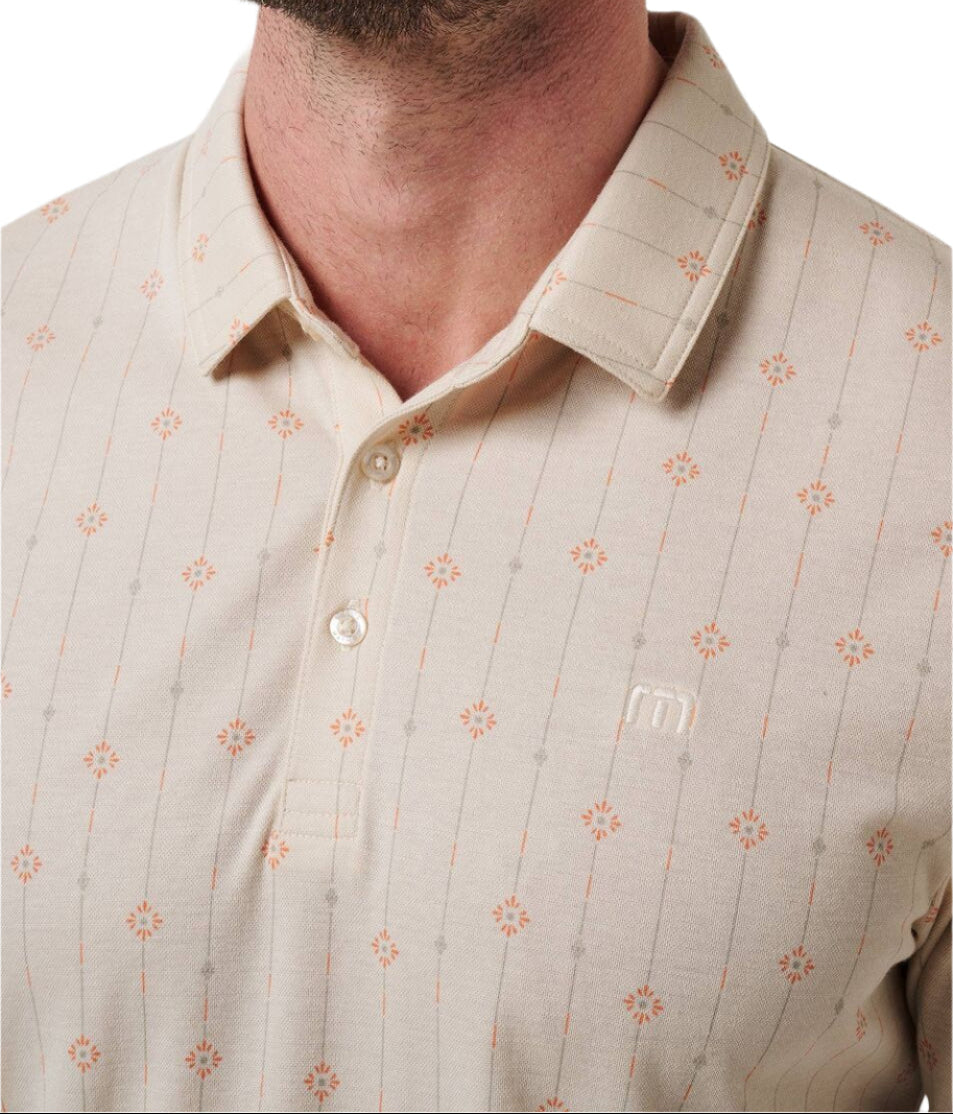 Close-up of a beige patterned shirt worn by a person