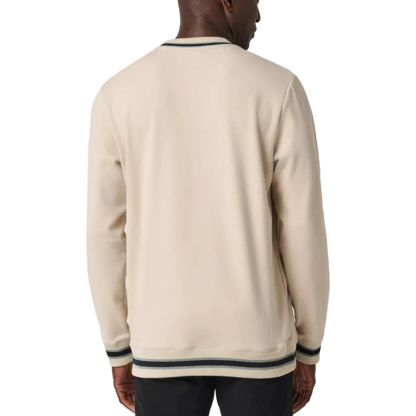 Man wearing a beige sweater with black trim on a white background