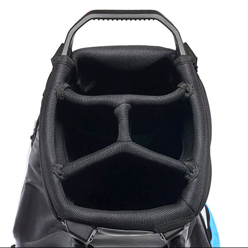 Close-up of the interior of a black golf bag, showing the padded compartment walls and top handle against a white background.