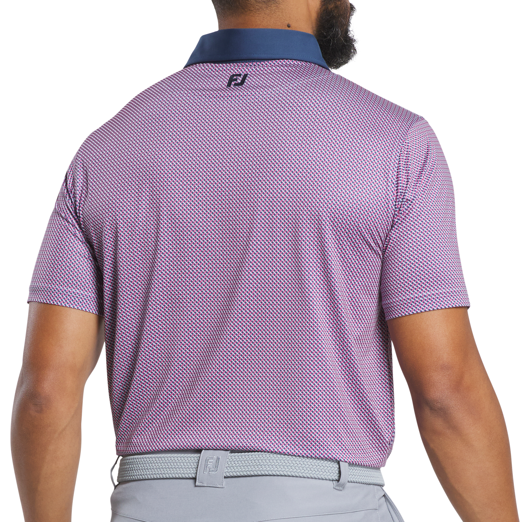 Man wearing a purple patterned polo shirt with a visible brand logo on the back.