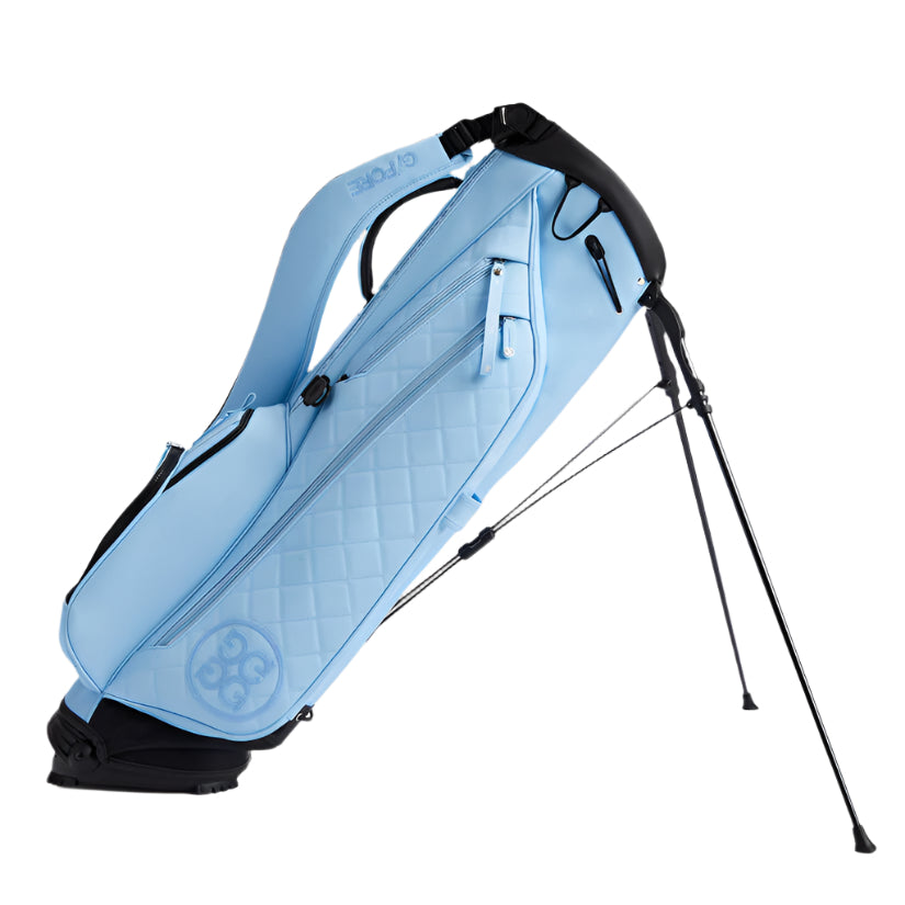 Light blue golf bag with black accents on a white background