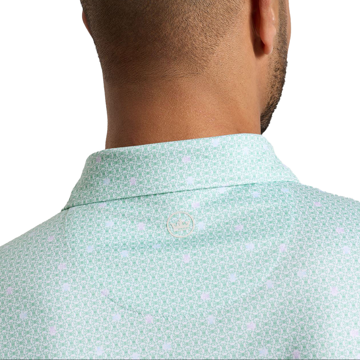 peter millar golf polo light green with skull pattern stripped with crown logo