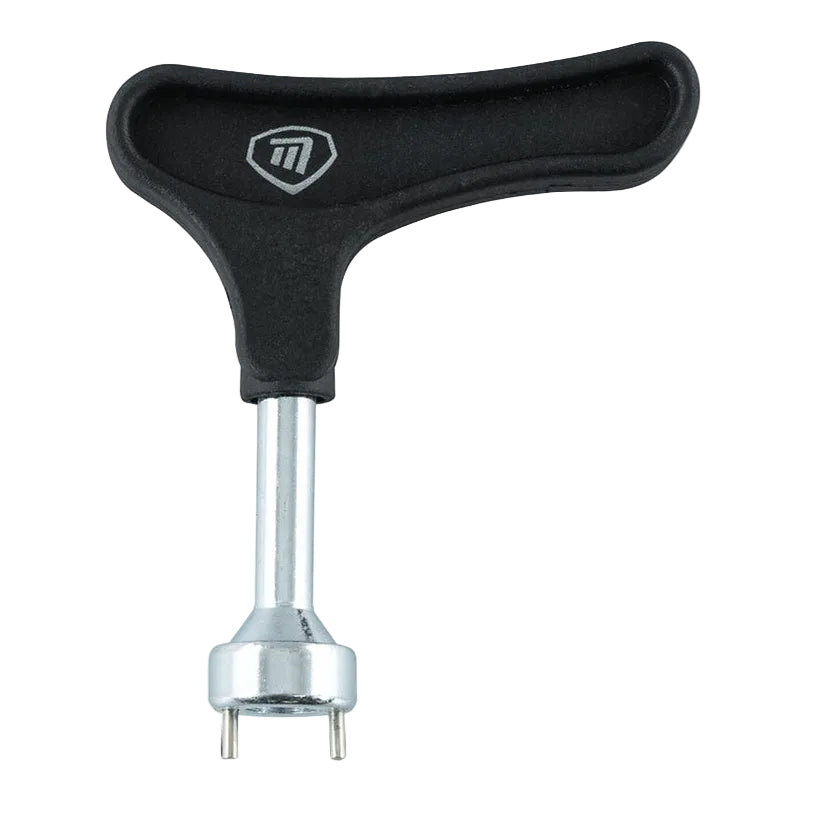 A T-shaped tire lever with a black textured handle and a silver metal shaft and base, featuring a white stylized 'M' logo on the handle, set against a plain white background.