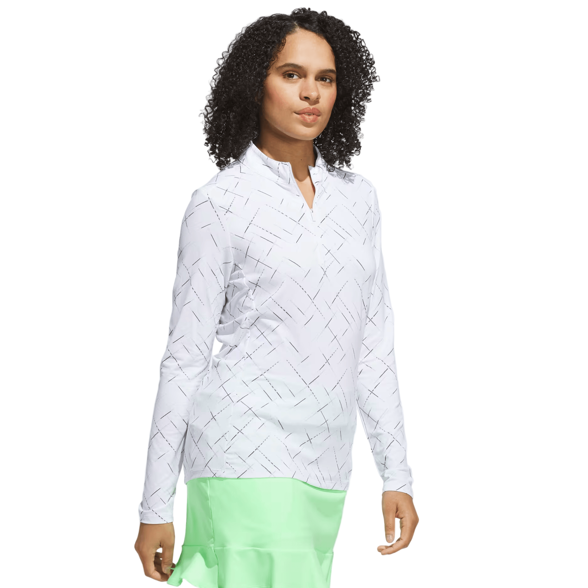 Woman wearing a white woven blouse and light green skirt on a white background