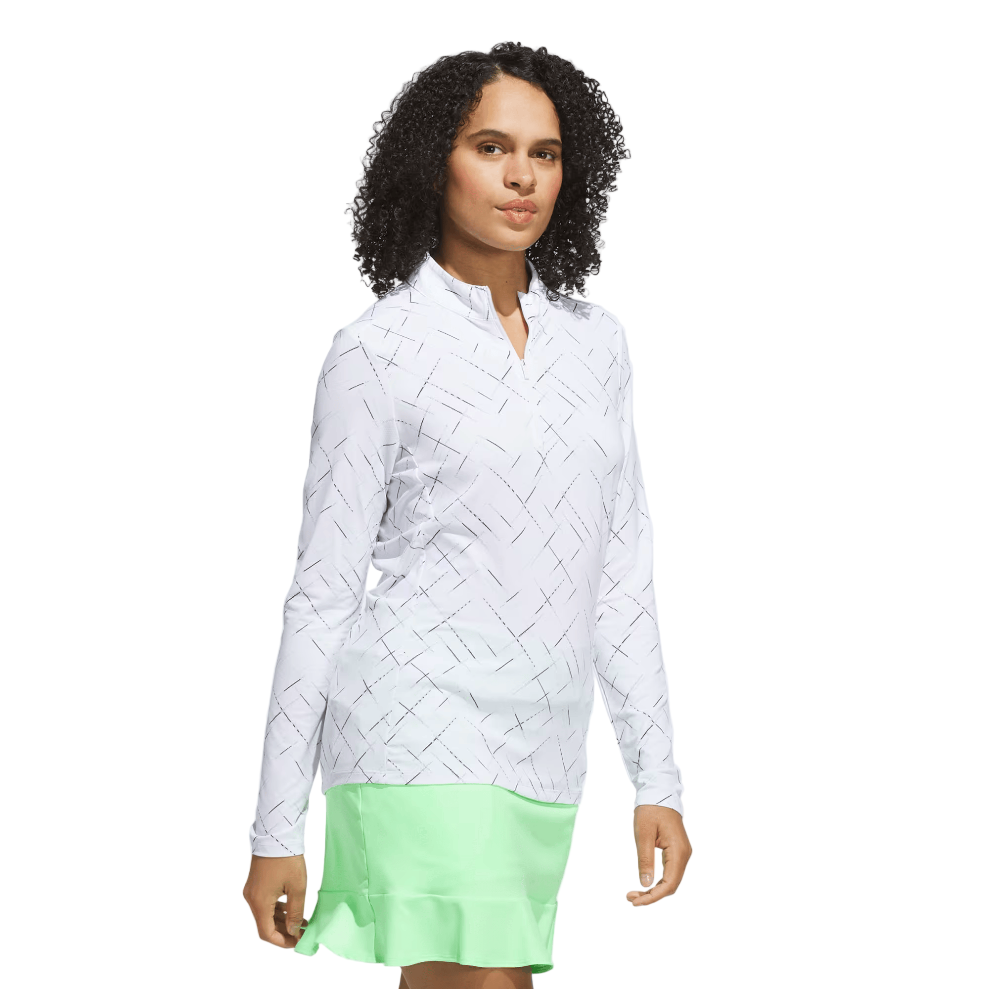Woman wearing a white woven blouse and light green skirt on a white background