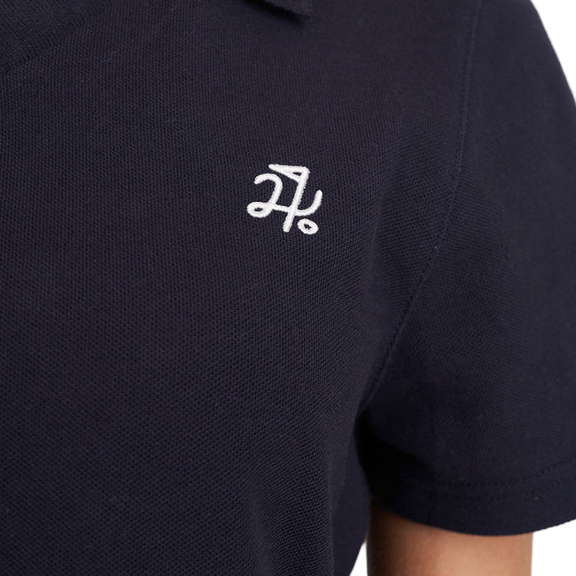 Navy blue polo shirt with a white logo on a white background