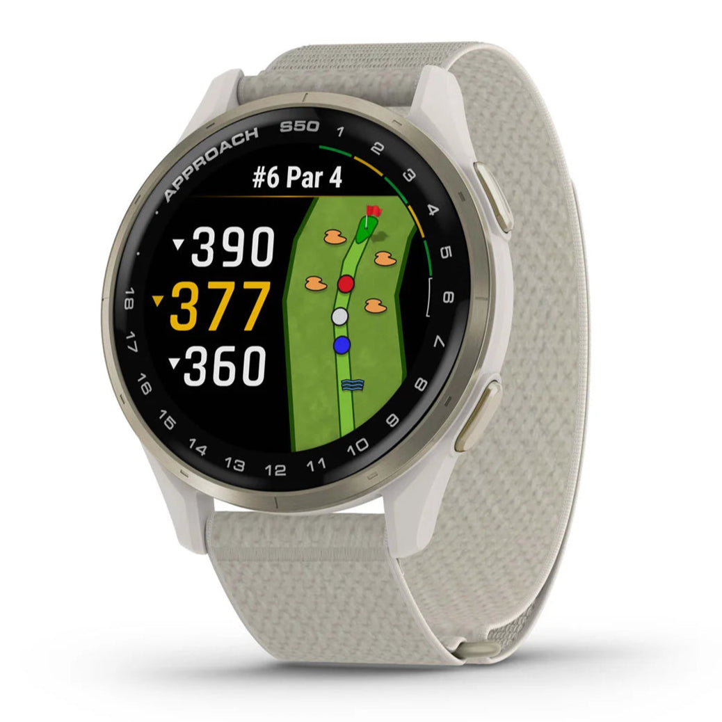 A gold Garmin Approach S50 GPS golf smartwatch with a beige band and a colorful display showing yardages on a golf course.